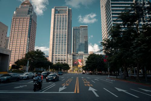 Free View of skyscrapers and busy street in downtown Taipei, showcasing urban life. Stock Photo