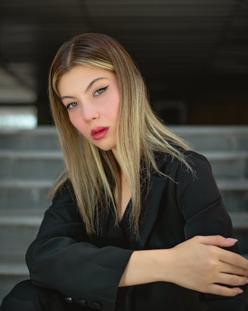 Photo of a Young Woman Wearing Elegant Black Clothing