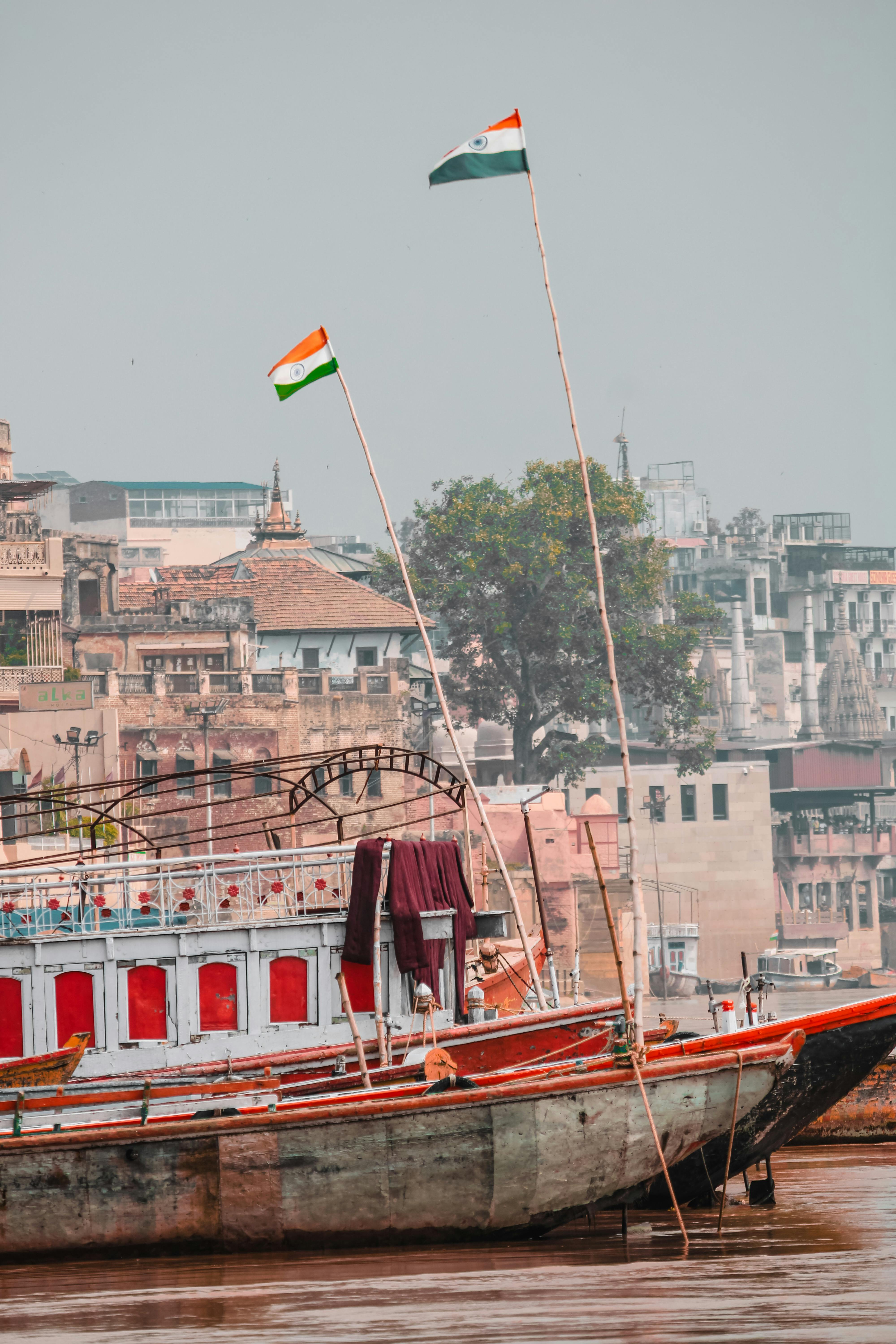 indian flag flaying high in river boat