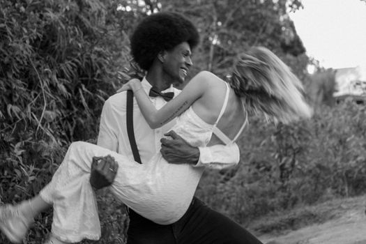 A couple in love shares a joyful moment during their wedding in Medellín, Colombia.