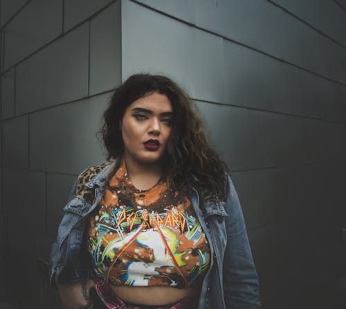 Woman Standing Near Gray Concrete Wall