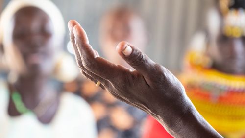 Free Detailed close-up of a hand with a ring, gesturing against a blurred background. Stock Photo