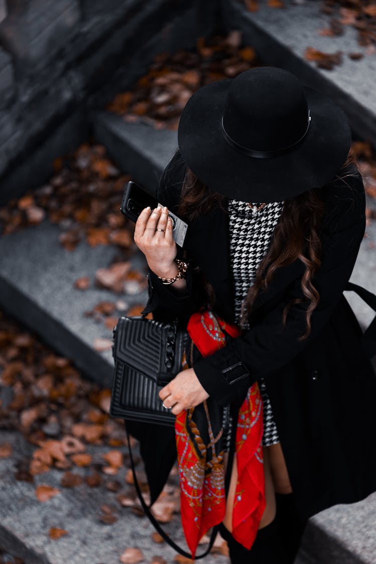 Elegant Woman In Coat And Hat