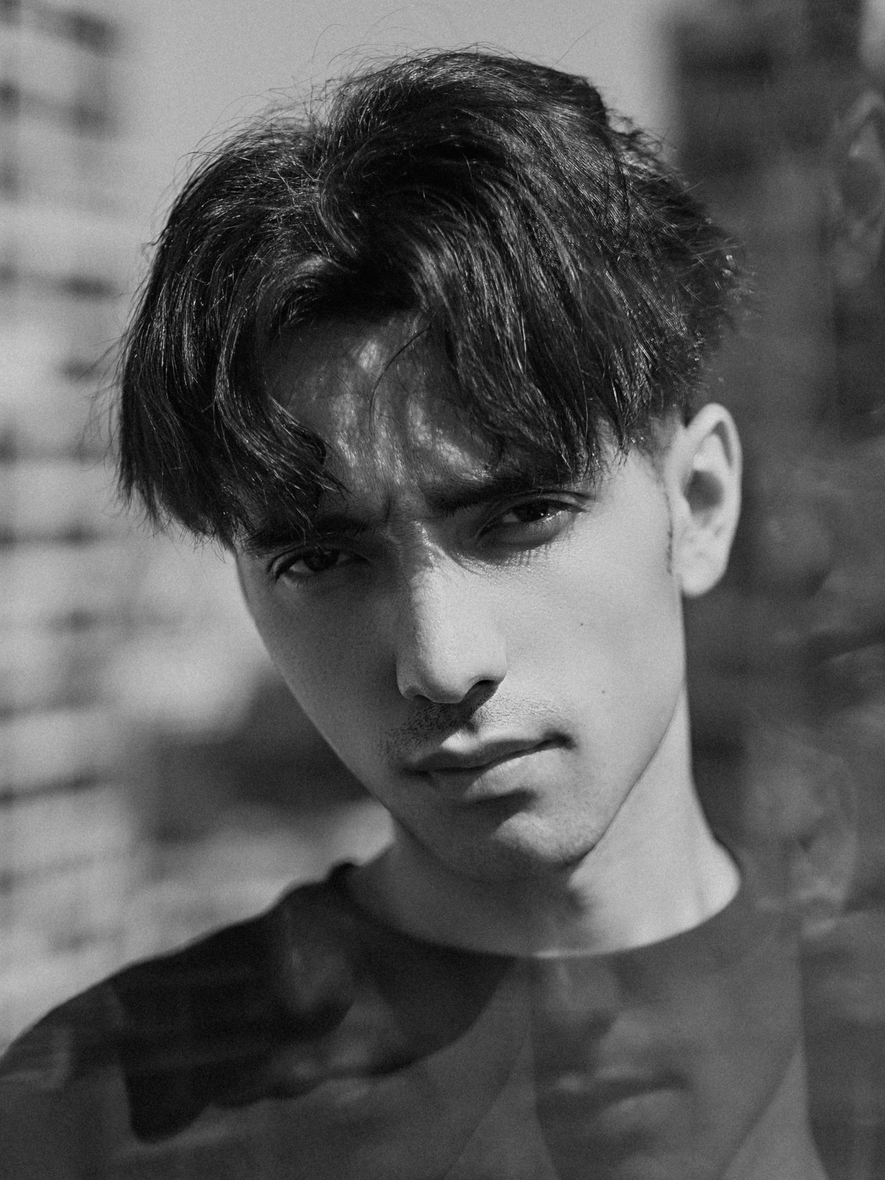 A black and white photo of a young man · Free Stock Photo