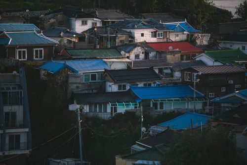 Free Aerial view of colorful houses in Gangneung, South Korea, showcasing a vibrant residential district. Stock Photo