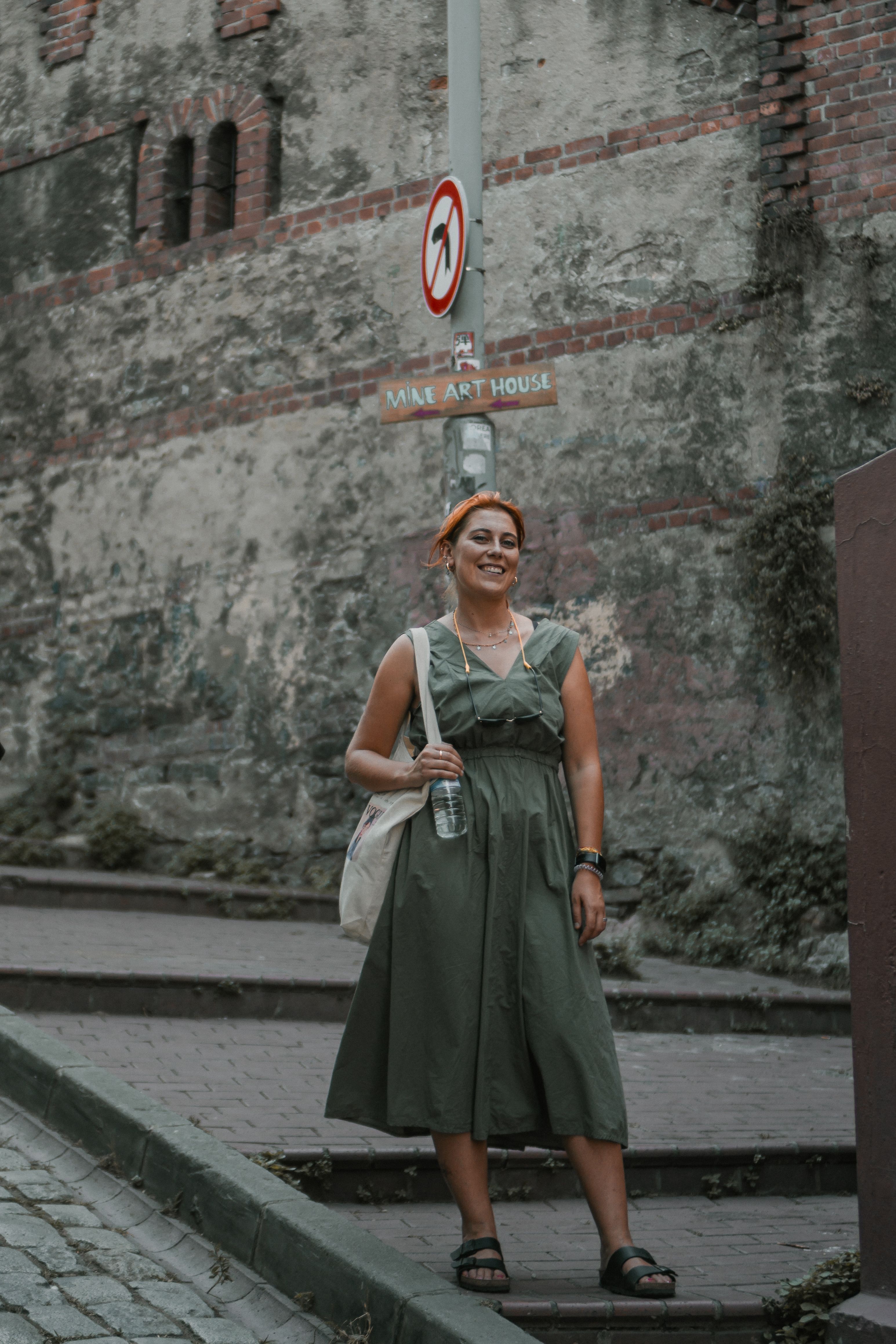 Woman Wearing Green Dress on a Street · Free Stock Photo