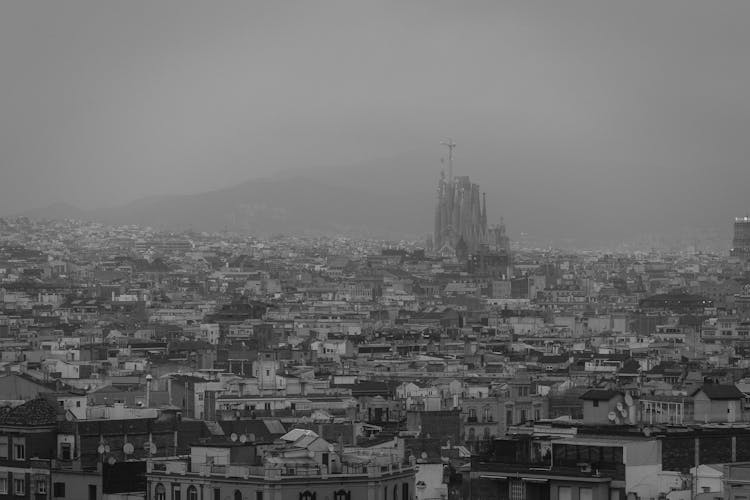 Fog Over Barcelona With La Sagrada Familia Behind