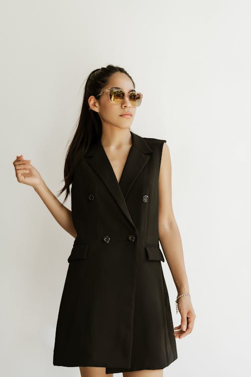 Model in Black, Sleeveless Coat