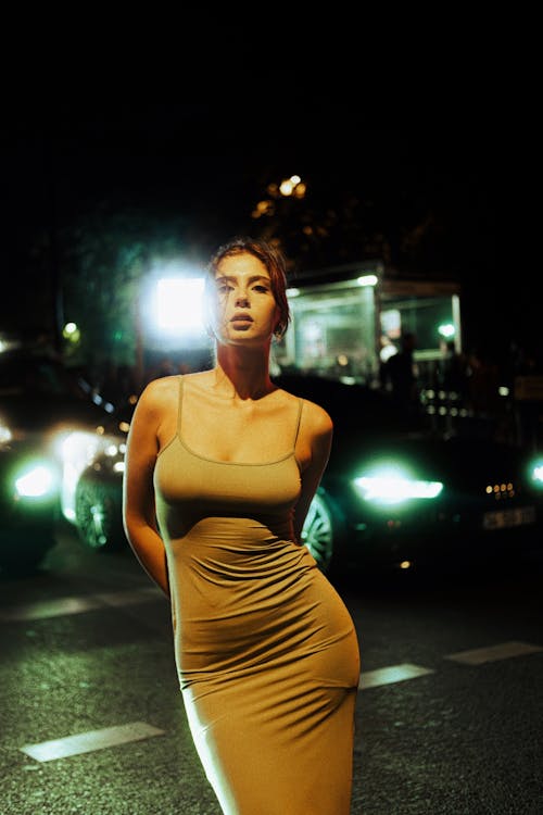 Model in Dress on Street at Night
