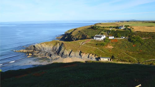 Village on Green Hills on Sea Coast