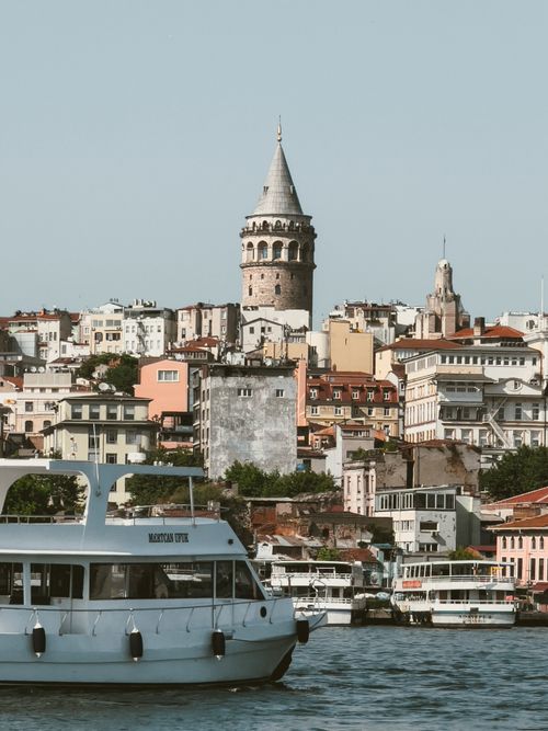 Free Explore the iconic Galata Tower amid Istanbul's vibrant cityscape and bustling waters. Stock Photo