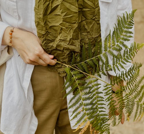 Woman Holding Fern Fronds