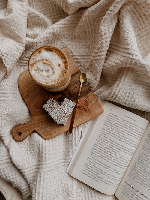 Free Coffee, Cakes and an Open Book Stock Photo