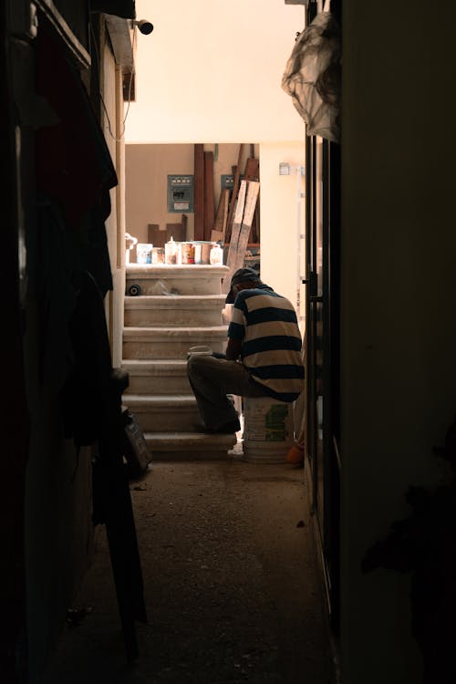 Man Sitting on a Construction Site 