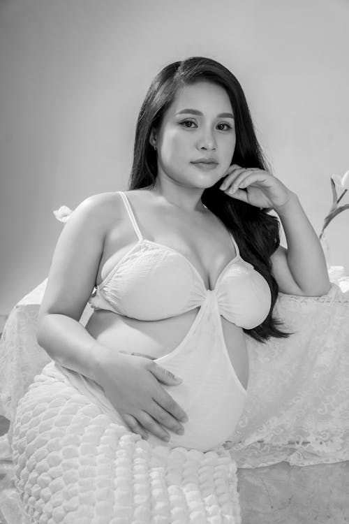 Pregnant Model in White Dress