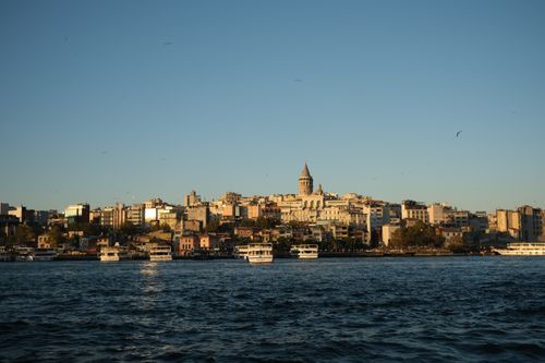 Free Scenic view of Istanbul's skyline with Galata Tower at sunset, overlooking the Bosporus. Stock Photo
