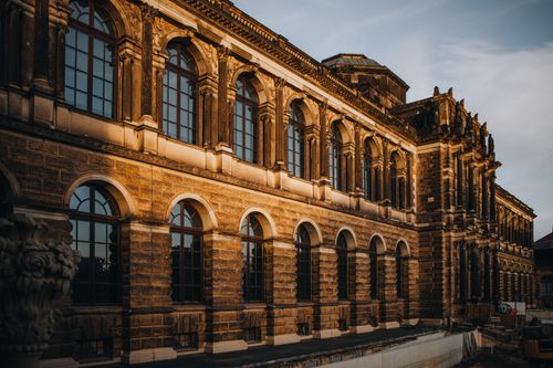 Free Rococo architectural detail of Zwinger Palace in Dresden illuminated in warm sunset light. Stock Photo