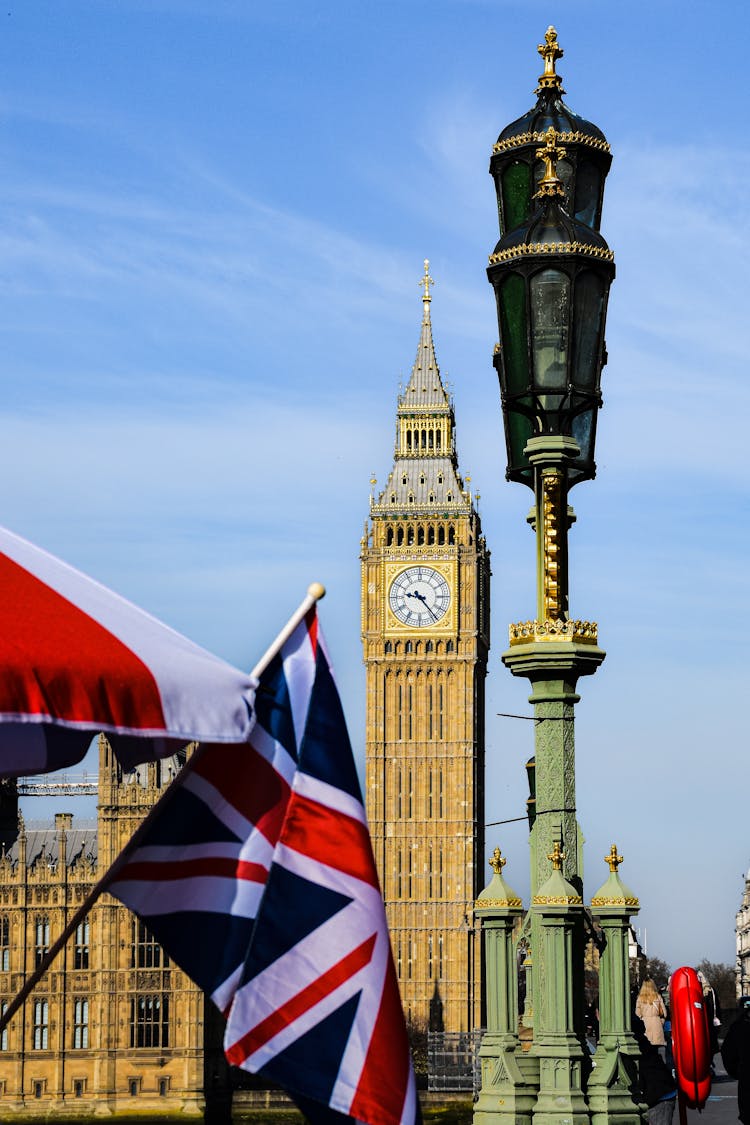 View Of Flags And The Big Ben In London, England, UK 