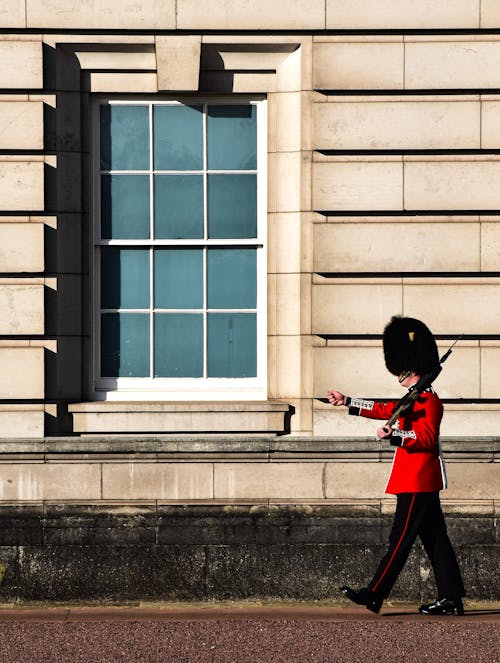 English Royal Guard Patrolling in front of Buckingham Palace 