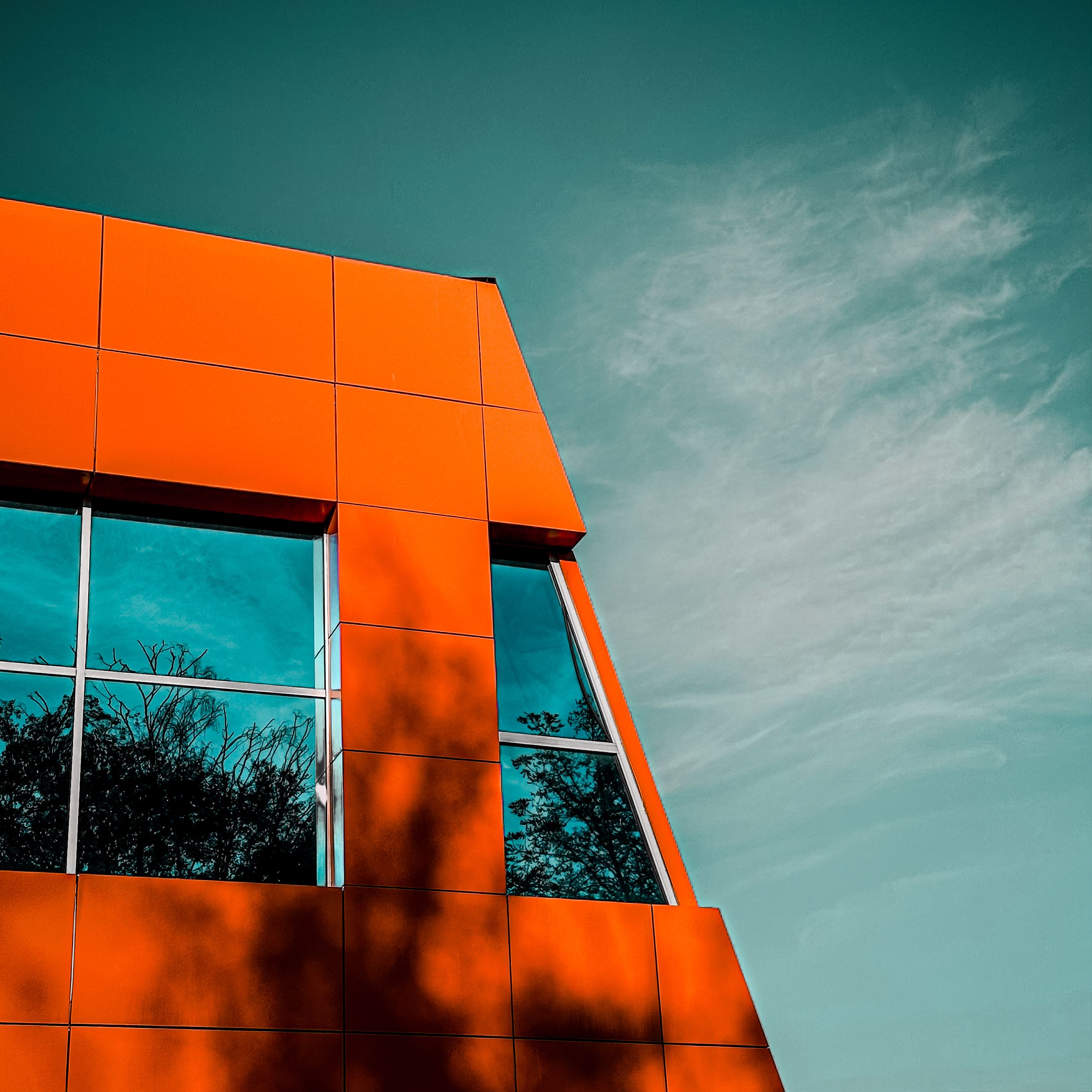 Facade of a Modern Orange Building in City 