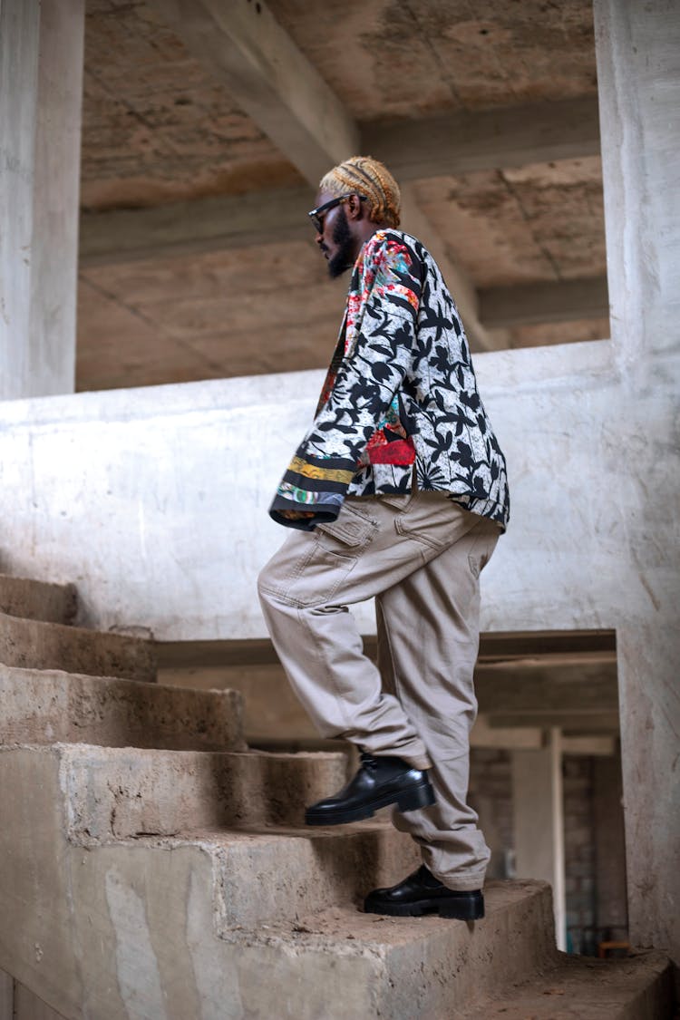 Man With Dyed, Blonde Hair Walking Upstairs