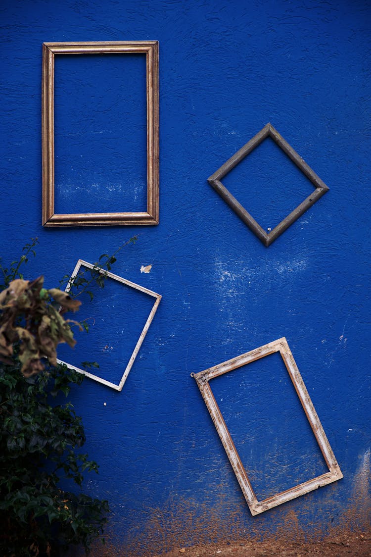 Empty Frames On Blue Building Wall