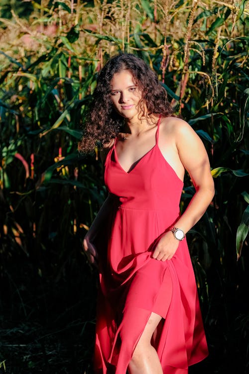 Model Standing in Red Dress