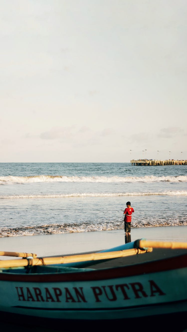 Boy Alone On Beach