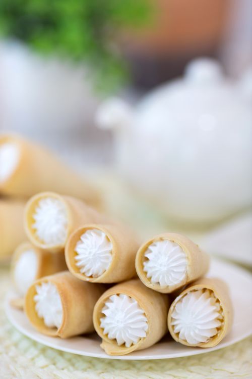 Free Close-up view of cream-filled pastry horns on a plate, a delicious treat in Baku, Azerbaijan. Stock Photo