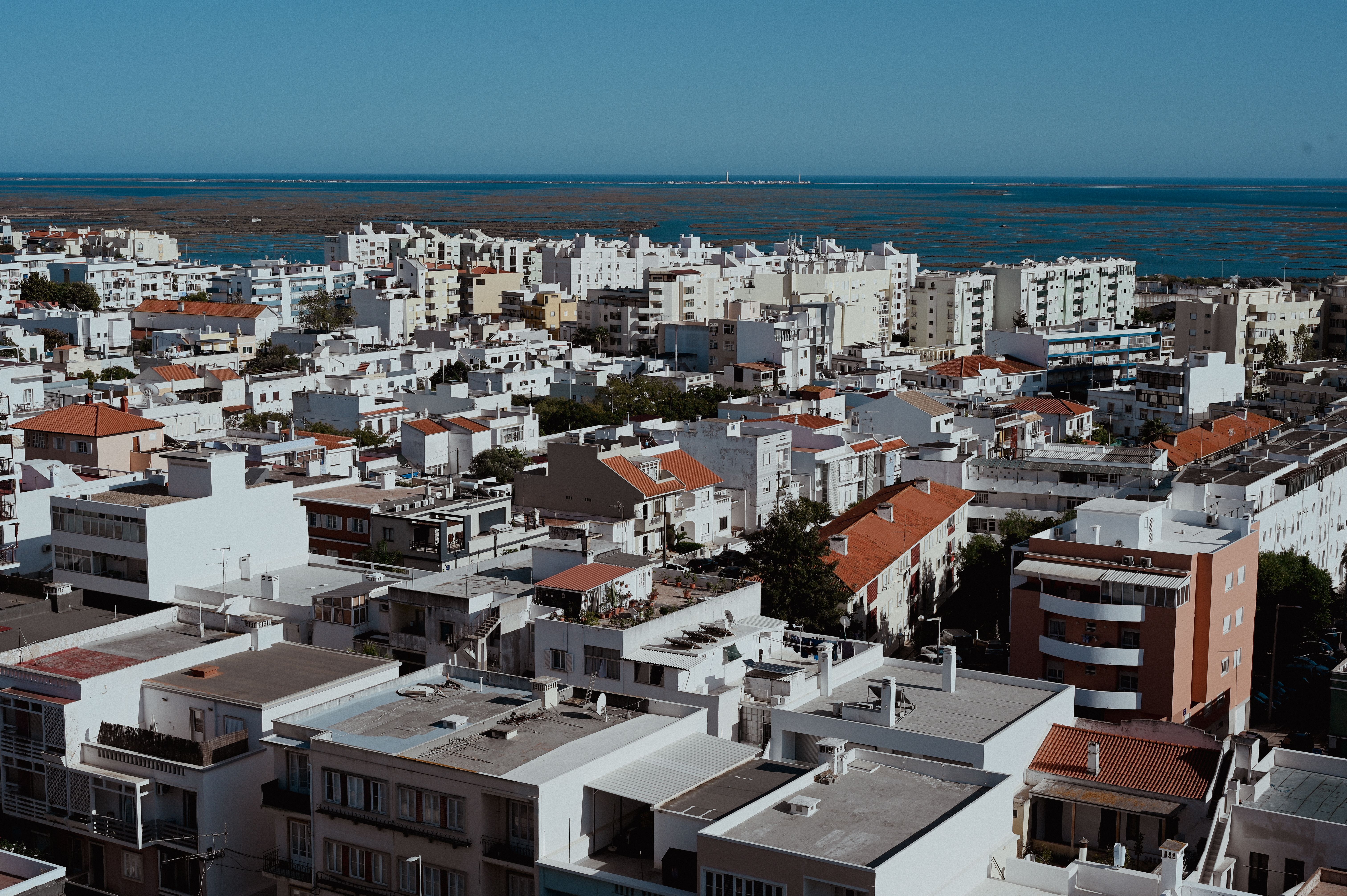 aerial-view-of-residential-buildings-in-a-city-near-the-sea-free