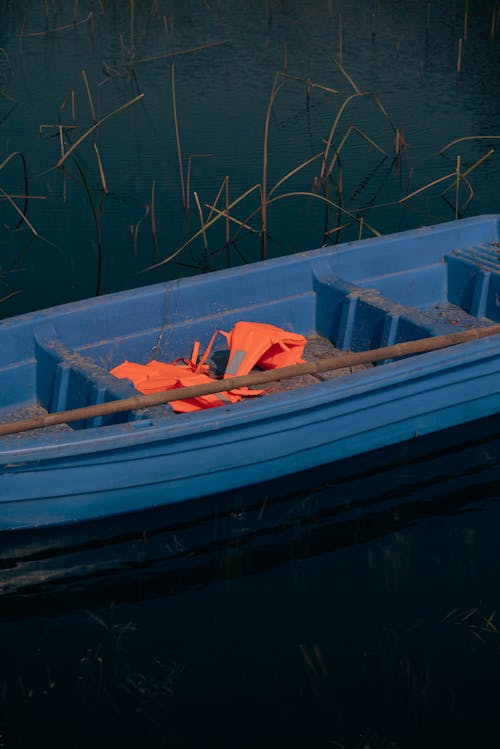 Close-up of a Blue Boat on a Body of Water 