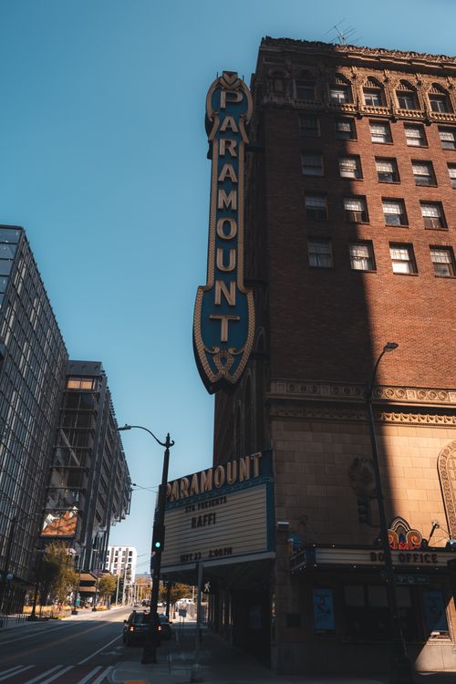 Free Vertical shot of Paramount Theater's distinctive facade in city environment. Stock Photo