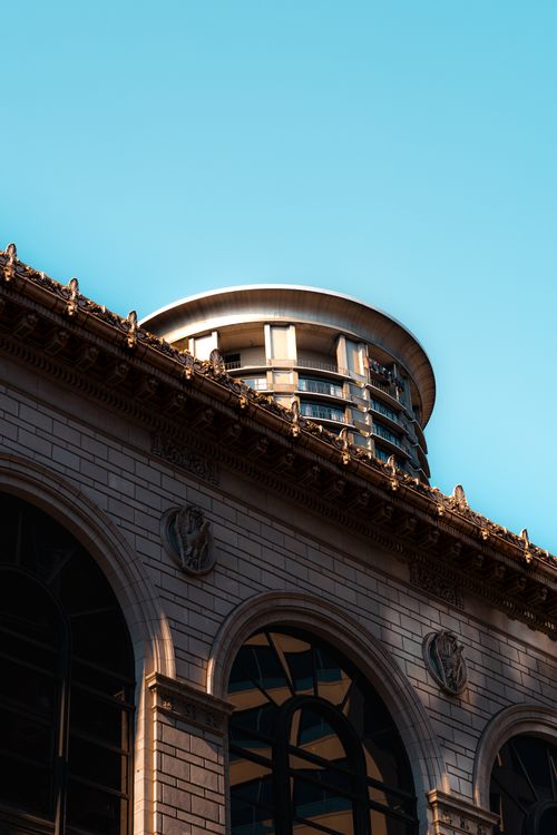 Free Close-up of an elegant modern tower against a clear sky, showcasing architectural detail. Stock Photo