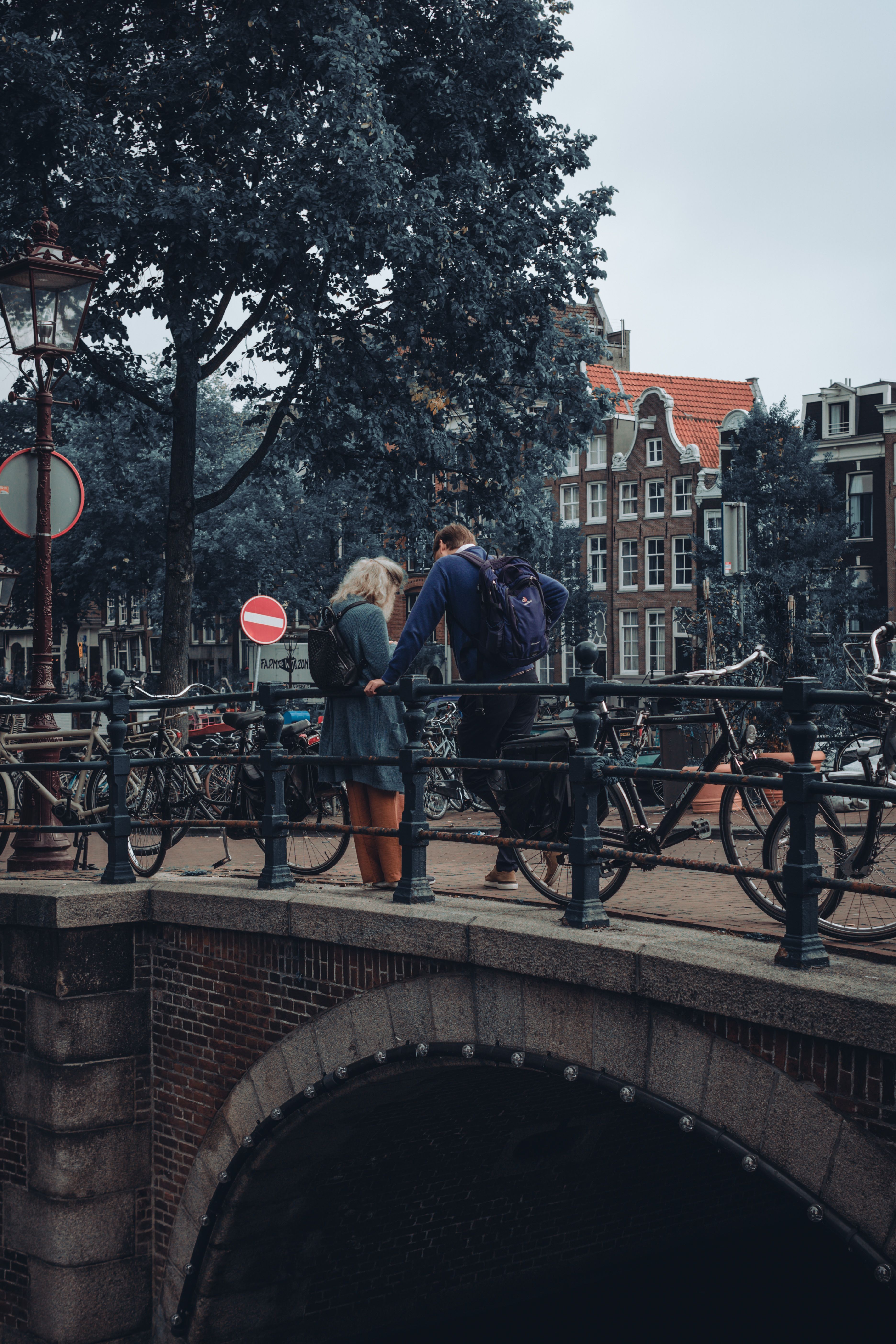 Couple looking at mobile phone together whilst travelling
