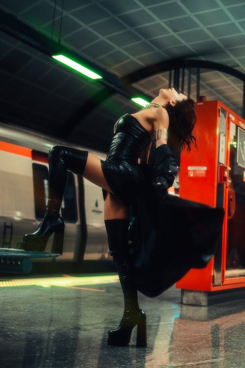 Model Posing in Black, Leather Clothes and Boots on Metro Station