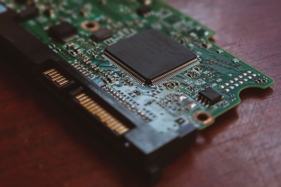 Photo by Arturo Añez. on Pexels Detailed shot of a computer circuit board showing components and golden pins.
