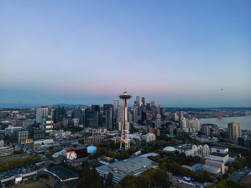Free Aerial view of Seattle's skyline featuring the iconic Space Needle against a twilight sky. Stock Photo