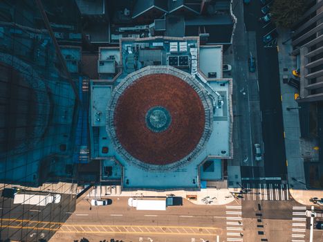 Top-down drone view of a dome and streets in Seattle, capturing urban architecture.