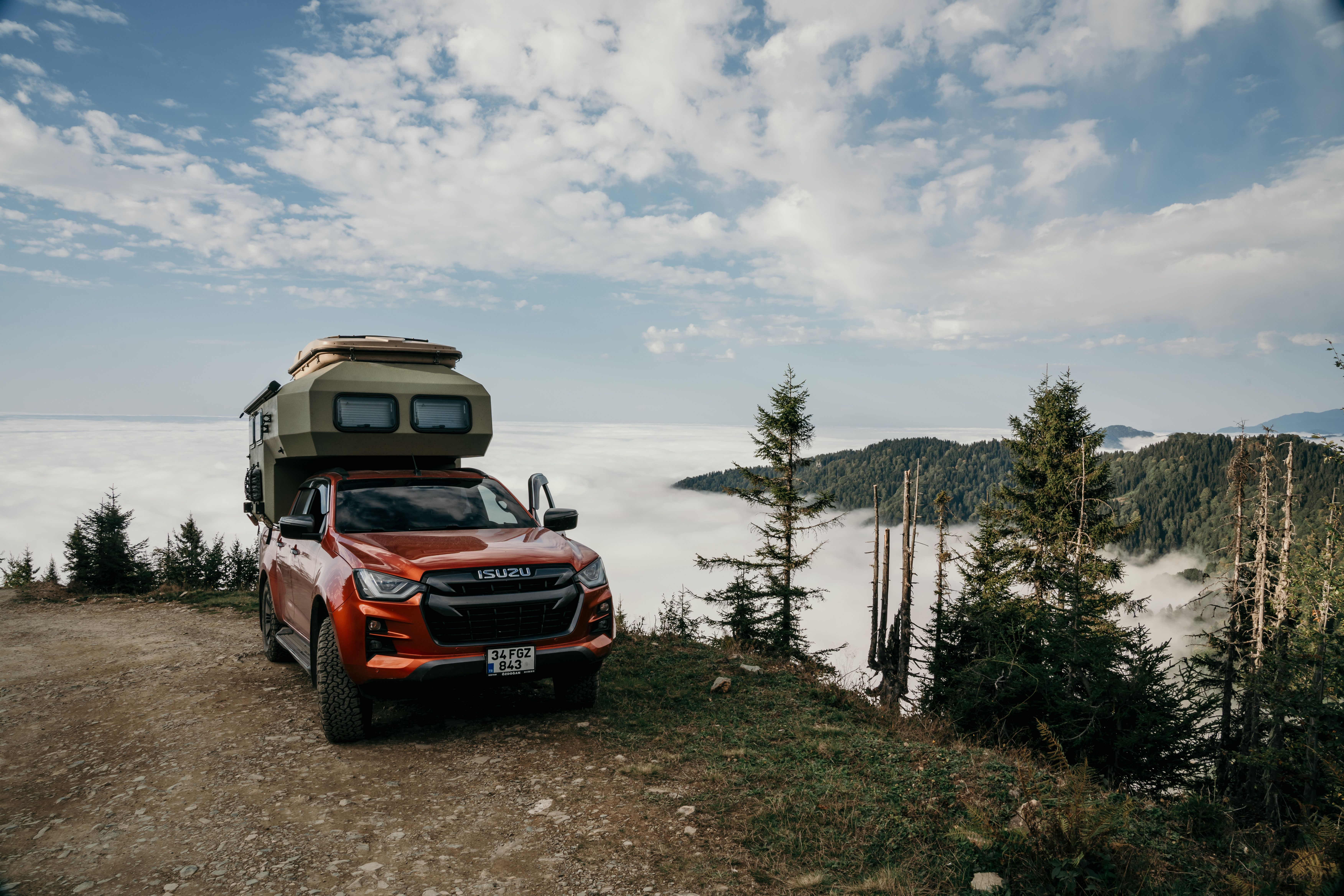 Off-road camper with roof tent in a foggy forest landscape, Rize, Türkiye.