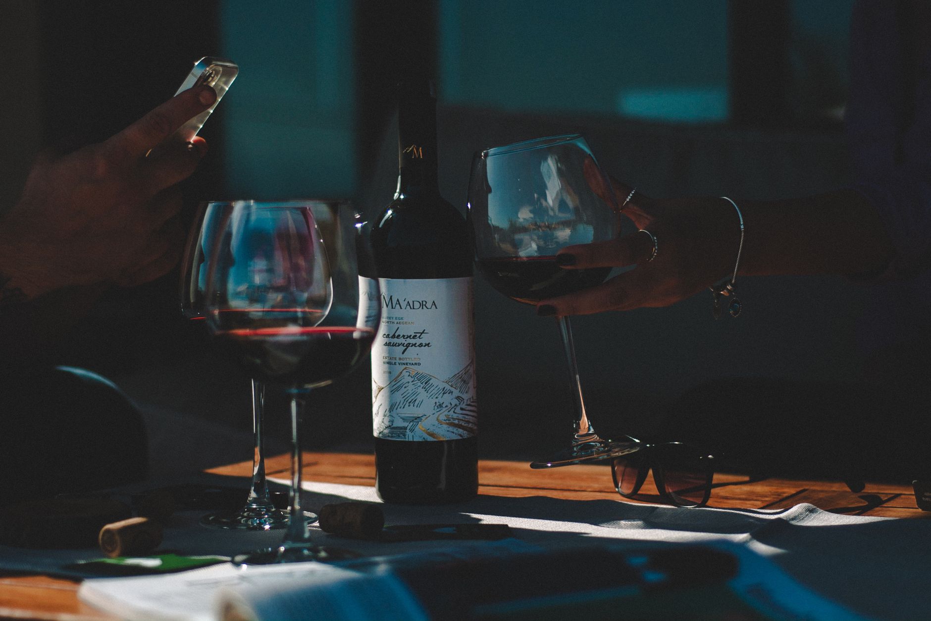 A full-bodied Cabernet Sauvignon wine in a crystal glass displaying deep ruby color and structured tannins.