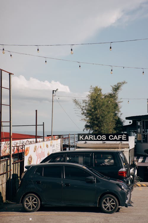 Cars Parked Next to the Kalros Cafe Van at the Seaside Parking Lot