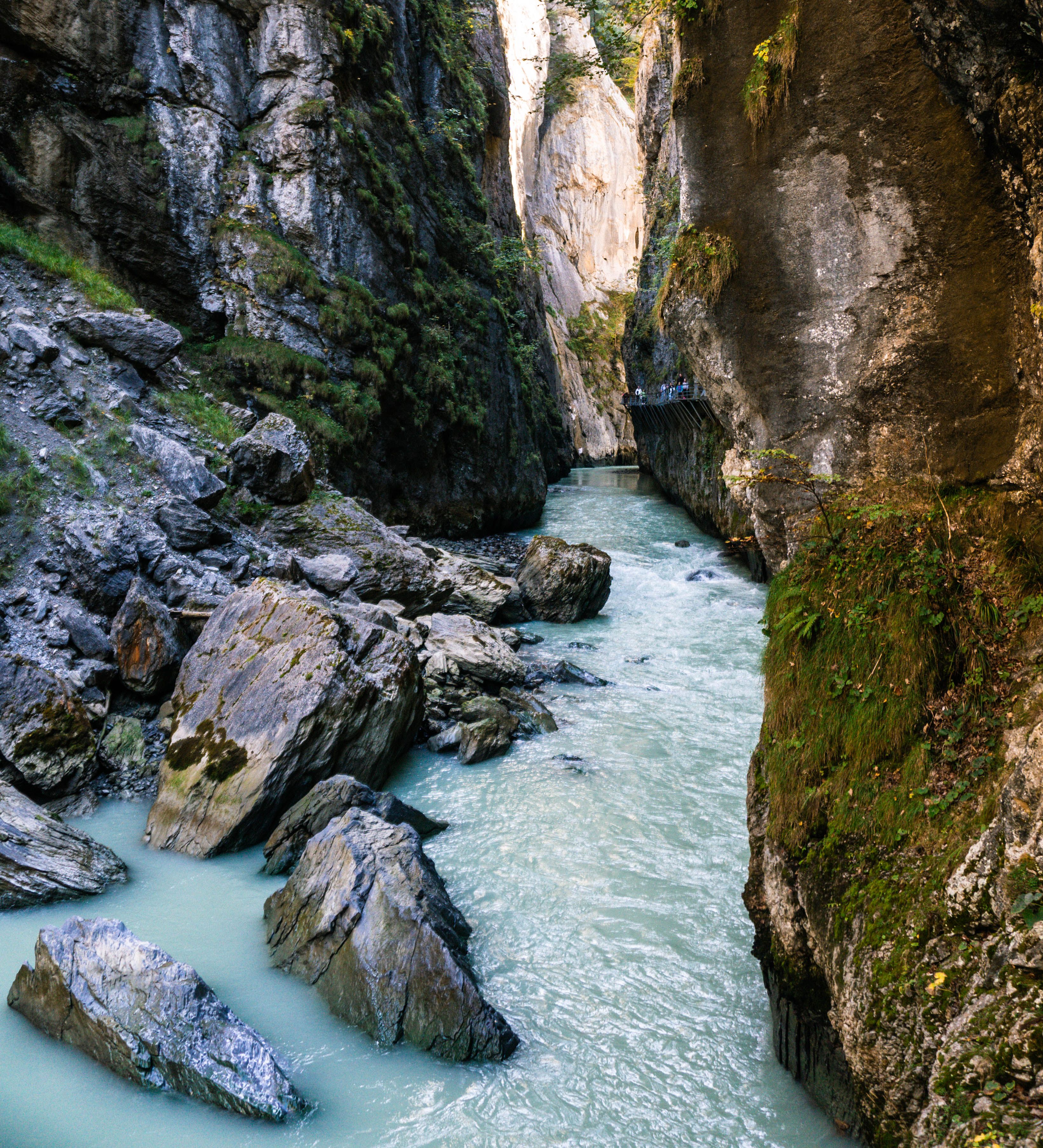 A river flowing through a narrow canyon · Free Stock Photo