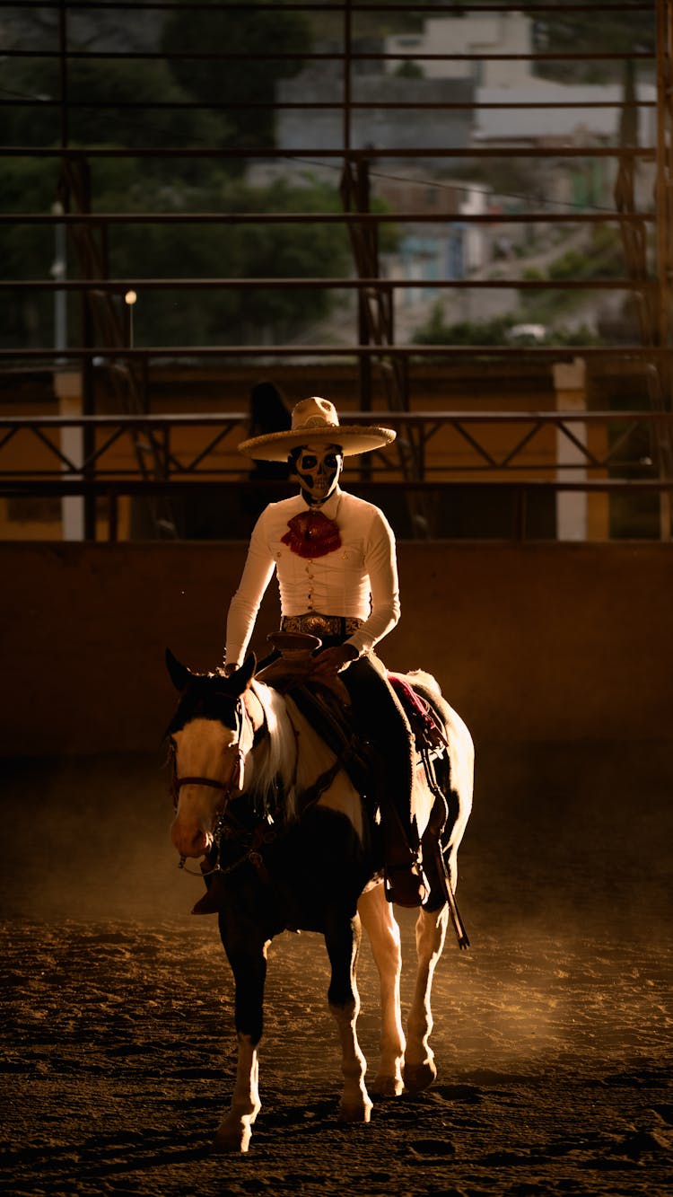 Man Wearing Mexican Costume Riding On A Horse 