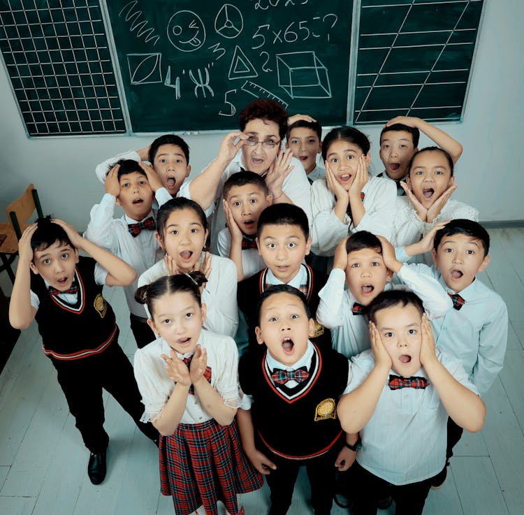 Teacher And Students Posing Together