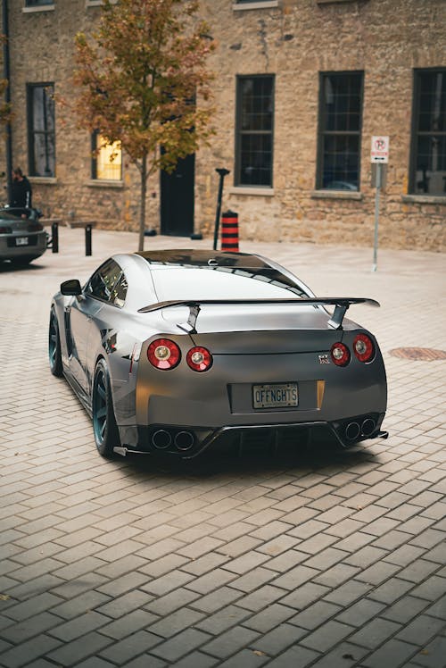 Gray Nissan GTR on Pavement in Back View