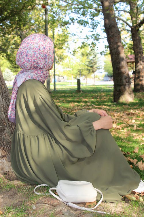 Woman in Hijab Sitting in Park