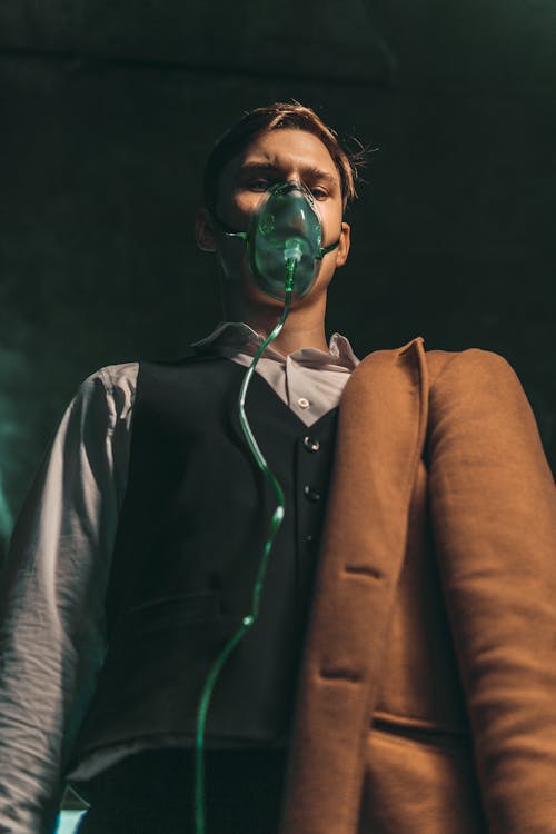 Portrait of Man in Oxygen Mask