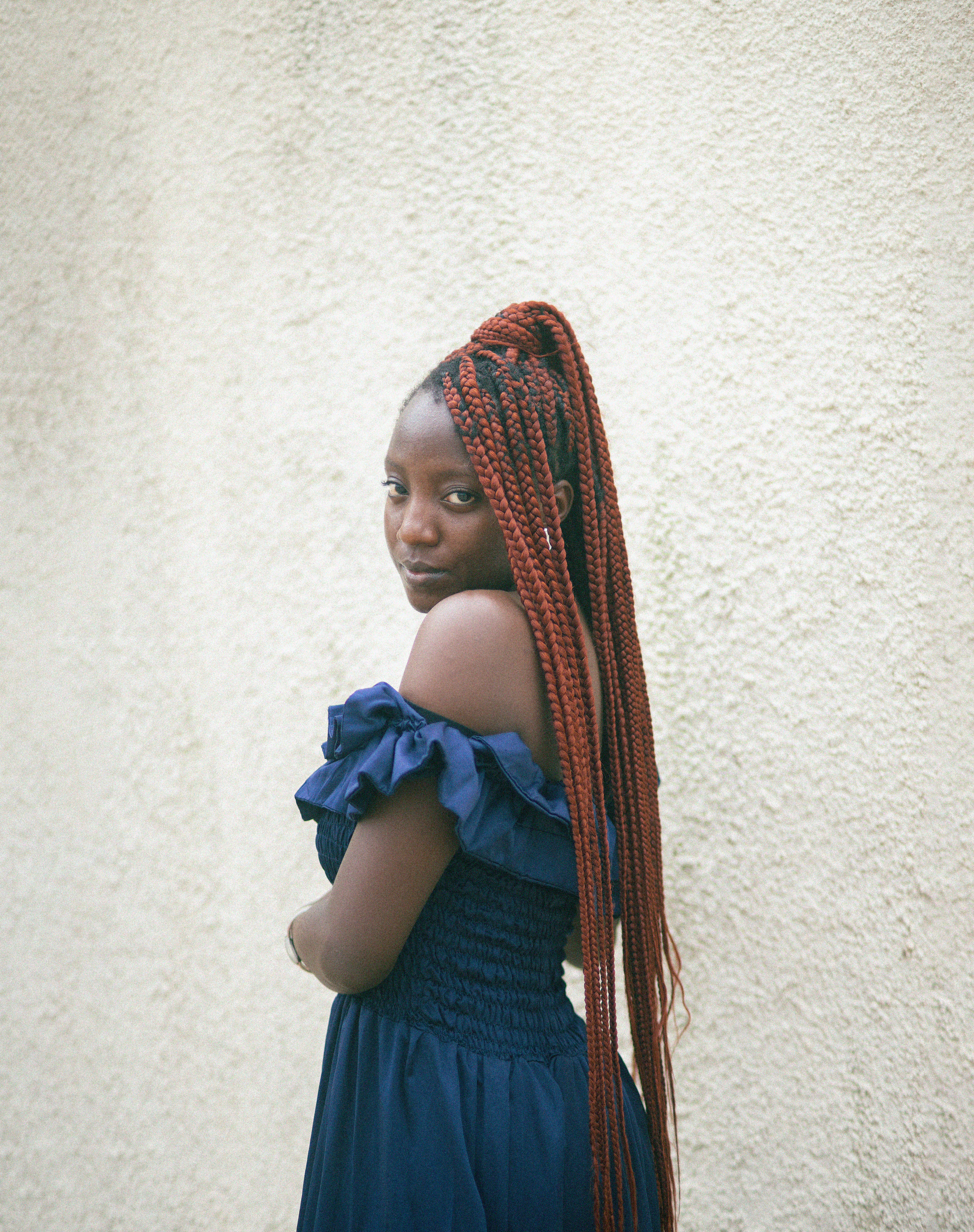 Young Woman with Braided Hair Posing in a Dress · Free Stock Photo