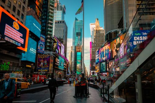 Free Colorful street view of Times Square with busy city life and iconic billboards in New York City. Stock Photo