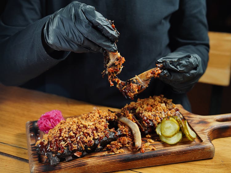 Chef Holding Roasted Ribs 